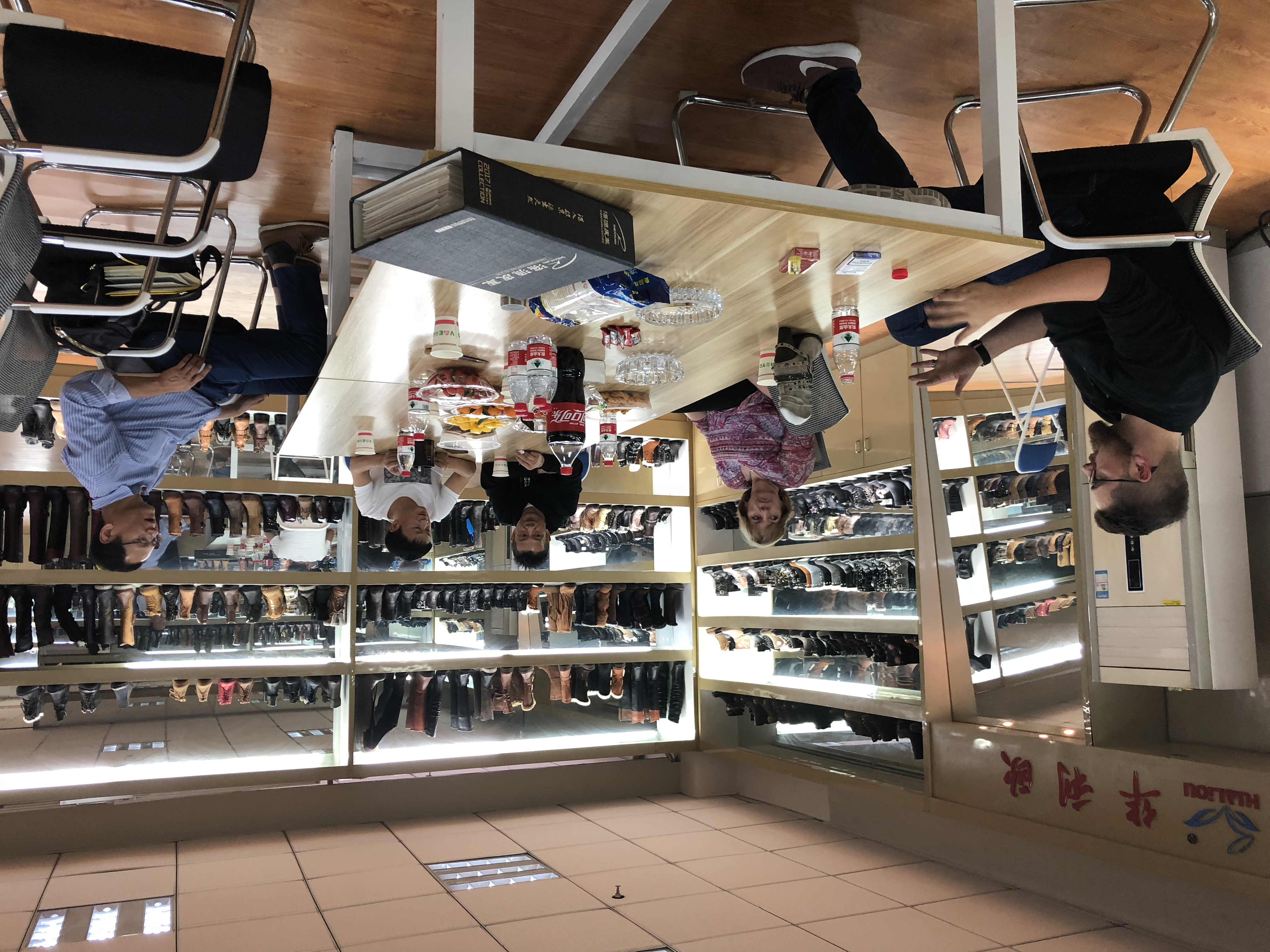 Meeting table and footwear sample displays at SHI JI